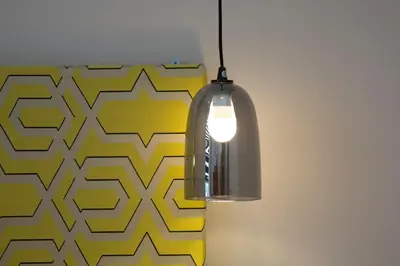 a light hanging from a wall with a patterned wall at Blackbird Luxury Apartments Room 2 in Blackpool
