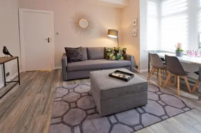 a living room with a couch and a table at Blackbird Luxury Apartments Room 1 in Blackpool