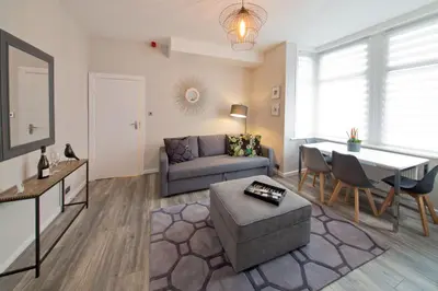 a living room with a couch and a table at Blackbird Luxury Apartments Room 1 in Blackpool