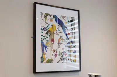 a framed picture of birds on a wall at Blackbird Luxury Apartments Room 1 in Blackpool