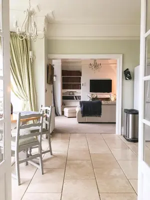 a living room with a couch and a table at East Bank Apartment in Grange Over Sands