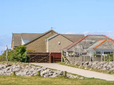 a row of houses with a sidewalk in front at Shorefields One in Morecambe