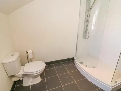 a bathroom with a toilet and a shower at Shorefields Two in Morecambe
