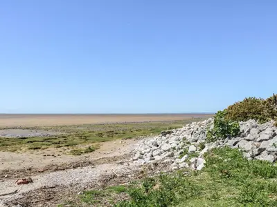 a rocky road in the middle of a field at Shorefields Two in Morecambe