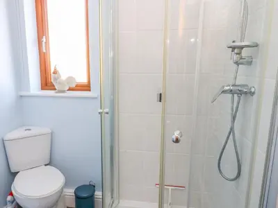 a bathroom with a shower with a toilet at Langtree in Carnforth