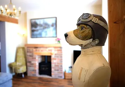 a statue of a dog wearing a helmet at Pippin Lodge Lytham in Lytham St Annes