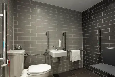 a bathroom with a toilet and a sink at Holiday Inn Express - Barrow-in-Furness & South Lakes by IHG in Barrow in Furness