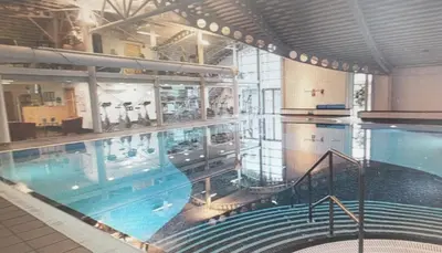 a large swimming pool in a building at 28 Borwick Lakes in Carnforth