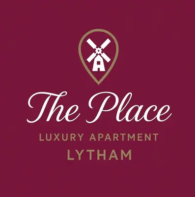 a purple logo for the place luxury apartment lxtrain at The Place - Lytham in Lytham St Annes