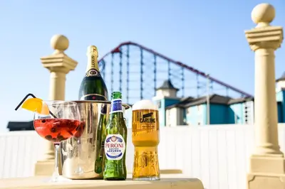 a table with two bottles of beer and a glass at Stuart hotel in Blackpool