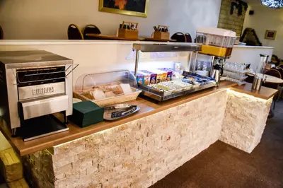 a counter with food on it in a restaurant at Stuart hotel in Blackpool