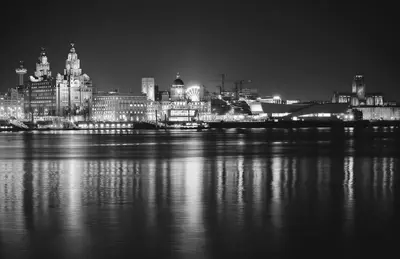 a black and white photo of a city at night at Cosy Anfield Guesthouse - Close to Stadium & City in Liverpool