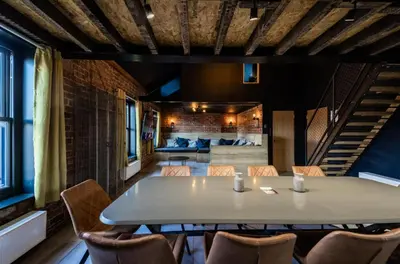 a dining room with a table and chairs at The Loft Sasco Apartments in Blackpool
