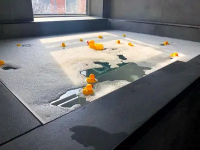 a bunch of rubber ducks sitting on a table at The Loft Sasco Apartments in Blackpool