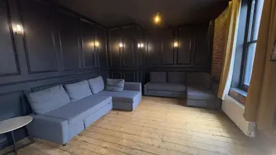 a living room with a couch and a table at The Residence Sasco Apartments in Blackpool
