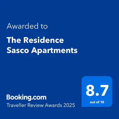 a blue sign with the text awarded to the resilience sasco apartments at The Residence Sasco Apartments in Blackpool