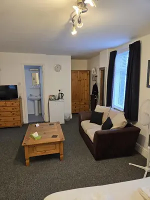 a living room with a couch and a coffee table at Q Accommodation in Blackpool