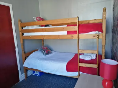 a bedroom with two bunk beds in a room at Birchhouse in Blackpool