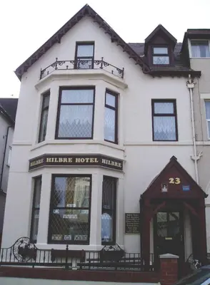 a white house with a harrisinger hotel at Hilbre Hotel in Blackpool