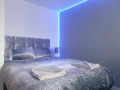 a bedroom with a bed with two towels on it at Shandon Apt premium Liverpool City Centre in Liverpool