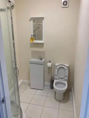 a small bathroom with a toilet and a sink at Smeaton serviced Accommodation in Liverpool