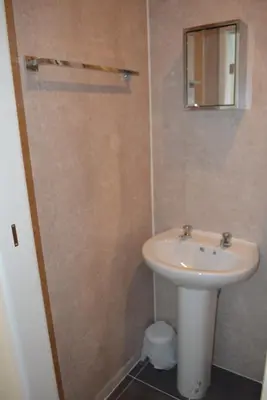 a bathroom with a sink and a mirror at BLACKPOOL MERCY Inn HOTEL in Blackpool