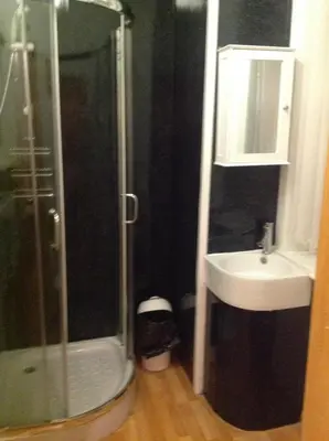 a bathroom with a shower and a sink at Fairhaven Hotel on Woodfield Road in Blackpool