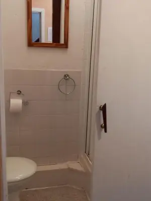 a bathroom with a sink and a toilet and a mirror at My Adam Hotel in Blackpool