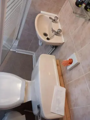a bathroom with a white toilet and a sink at My Adam Hotel in Blackpool