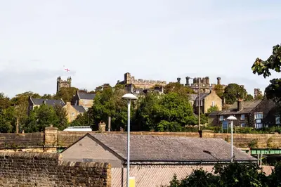 a view of a city with a castle in the background at Peaceful House in the Centre of City in Lancaster