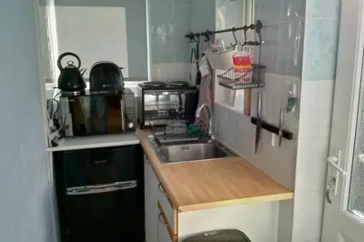 a small kitchen with a sink and a microwave at Peaceful House in the Centre of City in Lancaster