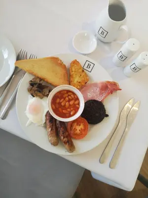 a plate of breakfast food on a table at Bradburys of Blackpool in Blackpool