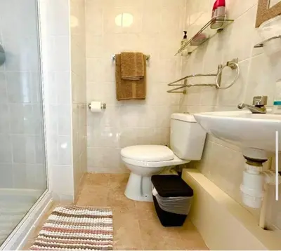a bathroom with a toilet and a sink at The Copplehouse in Southport