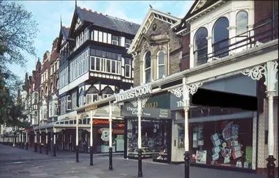 a row of buildings on a city street at Beach House Courtyard 1 bed in Southport