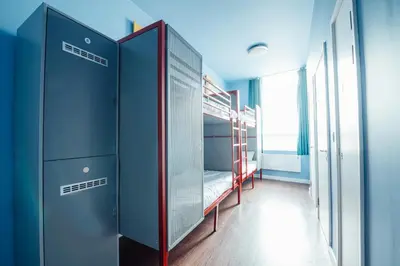a room with two bunk beds and a window at Kabannas Liverpool in Liverpool