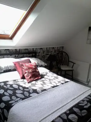 a bed with two pillows on it in a bedroom at The Breverton in Lytham St Annes