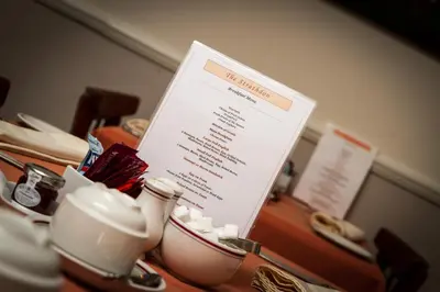 a menu sitting on top of a table with cups at The Strathdon in Blackpool