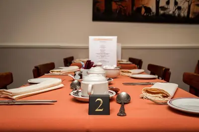 a long table with plates and utensils on it at The Strathdon in Blackpool