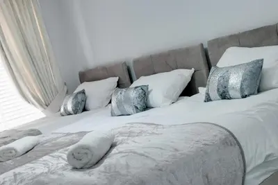 a large bed with white sheets and pillows at RST Rodney Street in Liverpool