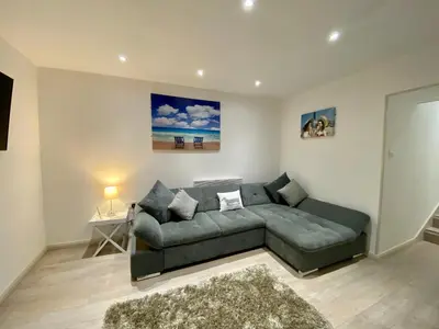 a living room with a couch and a table at Princess Theatre Beach View Apartments by Blackpool Service Apartments in Blackpool