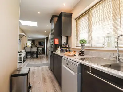 a kitchen with a sink and a counter at Kilmory Lodge in Poulton le Fylde