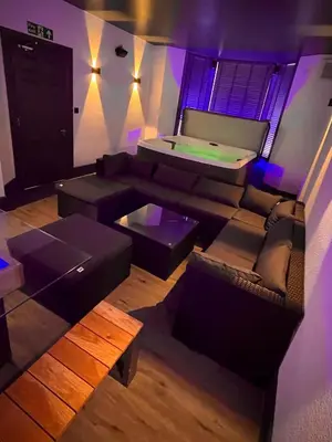 a living room with a couch and a pool table at Salt-Rock in Blackpool