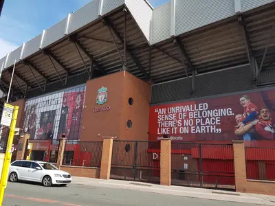 a sign on the side of a soccer stadium at Liverpool Anfield in Liverpool