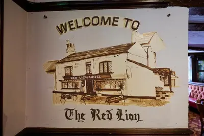a drawing of a building with the words welcome to the red room at Red Lion, Wigan by Marston's Inns in Rufford