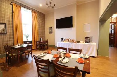 a dining room with a table and chairs at The Bridge Inn Hotel in Bolton