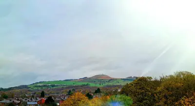 a view of a hill with a rainbow in the sky at The Bridge Inn Hotel in Bolton