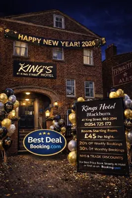 a building with a sign in front of it at BEST DEAL - Kings Hotel in Blackburn
