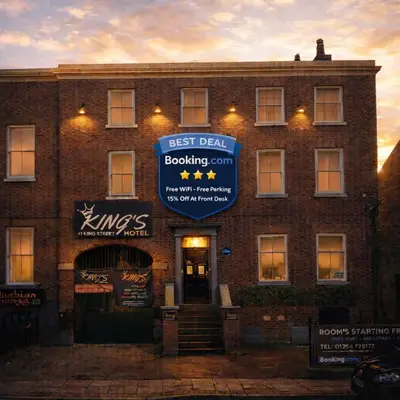 a building with a sign on the front of it at BEST DEAL - Kings Hotel in Blackburn