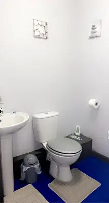 a bathroom with a white toilet and a sink at BEST DEAL - Kings Hotel in Blackburn