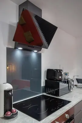 a kitchen with a hood over a stove top oven at ApartHotel421 by Seafront Collection in Blackpool